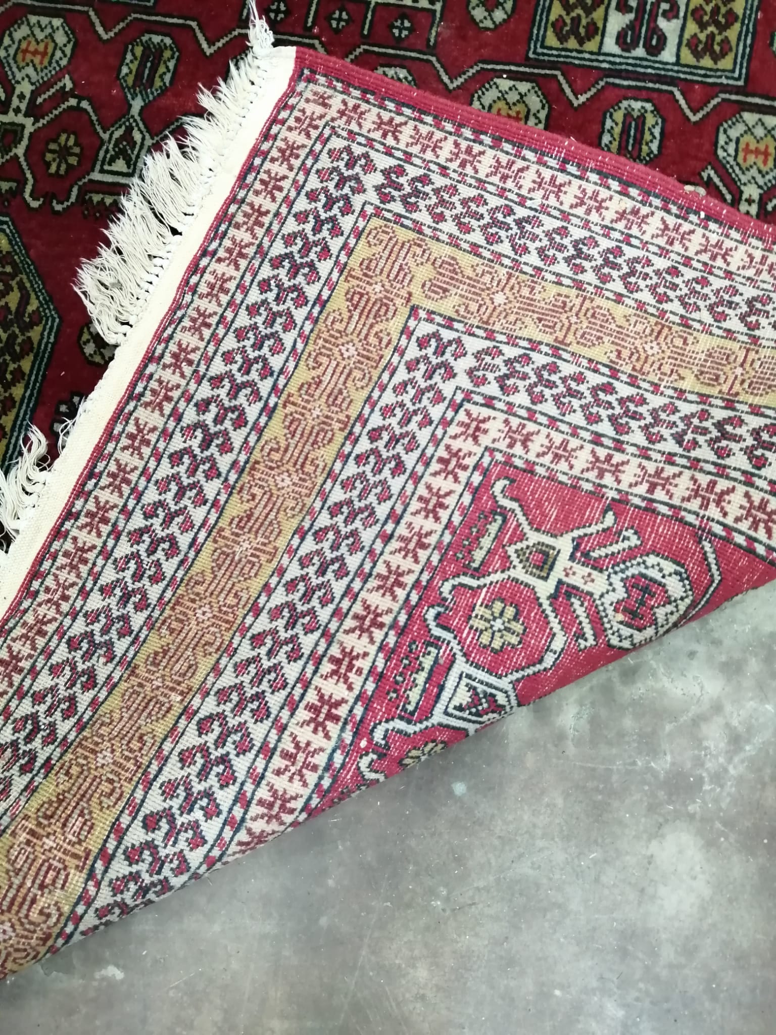 An Azerbaijan red ground rug, circa 1920, 240 x 150cm